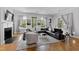 Spacious living room with hardwood floors, sectional sofa, and fireplace at 620 Wade Ave # 301, Raleigh, NC 27605