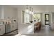 Modern kitchen with large island and white cabinets at 2629 Sidford Aly, Raleigh, NC 27608