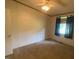 Bright bedroom with carpeted floors and ceiling fan at 910 Vanco Mill Rd, Henderson, NC 27537