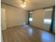 Bedroom with hardwood floors and teal curtains at 910 Vanco Mill Rd, Henderson, NC 27537