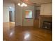 Living room with hardwood floors and fireplace at 910 Vanco Mill Rd, Henderson, NC 27537