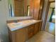 Double vanity with wood cabinets and large mirrors at 910 Vanco Mill Rd, Henderson, NC 27537