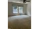 Spacious bedroom with ceiling fan and large window at 492 Beechmast, Pittsboro, NC 27312