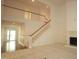 Living room with hardwood floors, staircase, and fireplace at 492 Beechmast, Pittsboro, NC 27312