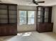 Bedroom with built-in bookshelves and a window at 492 Beechmast, Pittsboro, NC 27312