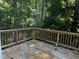 Wooden deck overlooks wooded area, offering a peaceful view at 492 Beechmast, Pittsboro, NC 27312