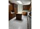 Kitchen with island, wood cabinets, and tile flooring at 492 Beechmast, Pittsboro, NC 27312