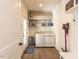 Laundry room with washer, dryer, and shelving at 209 E Whitaker Mill Rd, Raleigh, NC 27608