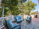 Deck with blue couches and chairs, great for entertaining at 209 E Whitaker Mill Rd, Raleigh, NC 27608