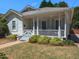 Charming one-story home with a front porch and landscaping at 209 E Whitaker Mill Rd, Raleigh, NC 27608