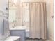 Updated bathroom with marble vanity and shower at 209 E Whitaker Mill Rd, Raleigh, NC 27608