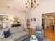 Comfortable living room with vaulted ceiling, hardwood floors, and large windows at 209 E Whitaker Mill Rd, Raleigh, NC 27608