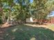 Large backyard with a shed and wooden bench at 209 E Whitaker Mill Rd, Raleigh, NC 27608