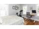 Bedroom with desk and exercise bike, ideal home office at 209 E Whitaker Mill Rd, Raleigh, NC 27608