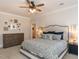 Main bedroom with king-size bed and ample dresser storage at 209 E Whitaker Mill Rd, Raleigh, NC 27608