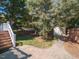 Private backyard with patio, storage shed, and lush landscaping at 209 E Whitaker Mill Rd, Raleigh, NC 27608