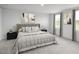 Spacious main bedroom with plush carpeting and large windows at 290 Gianna Dr, Lillington, NC 27546