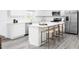 Modern kitchen with white cabinets, island, and stainless steel appliances at 290 Gianna Dr, Lillington, NC 27546