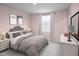 Charming bedroom with a grey and pink color scheme and ample closet space at 290 Gianna Dr, Lillington, NC 27546