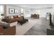 Open living room featuring hardwood floors, neutral color palette, and ample natural light at 290 Gianna Dr, Lillington, NC 27546
