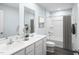 Bathroom with double vanity, tub shower combo and grey flooring at 290 Gianna Dr, Lillington, NC 27546
