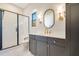 Modern bathroom with a walk-in shower, white subway tiles, and dark vanity at 212 Meadow Walk Dr, Fuquay Varina, NC 27526