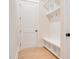 Functional mudroom with built-in bench, cubbies, and hooks at 212 Meadow Walk Dr, Fuquay Varina, NC 27526