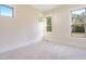 Bright bedroom with carpet and multiple windows at 212 Meadow Walk Dr, Fuquay Varina, NC 27526