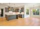 Modern kitchen with dark cabinetry, quartz countertops and island at 212 Meadow Walk Dr, Fuquay Varina, NC 27526