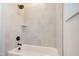 Bathroom with a shower/tub combo and light gray tile at 212 Meadow Walk Dr, Fuquay Varina, NC 27526