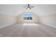 Large bedroom with dormer window, ceiling fan, and plush carpeting at 212 Meadow Walk Dr, Fuquay Varina, NC 27526