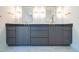 Double vanity bathroom with marble flooring and gold accents at 212 Meadow Walk Dr, Fuquay Varina, NC 27526