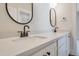 Double vanity bathroom with modern finishes and frameless shower at 212 Meadow Walk Dr, Fuquay Varina, NC 27526