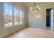 Light and airy office featuring hardwood floors and built-in shelving at 212 Meadow Walk Dr, Fuquay Varina, NC 27526