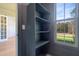 Built-in pantry with multiple shelves and a window providing natural light at 212 Meadow Walk Dr, Fuquay Varina, NC 27526