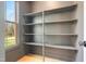 Functional pantry with ample shelving and natural light at 212 Meadow Walk Dr, Fuquay Varina, NC 27526