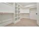 Bright walk-in closet featuring ample shelving and hanging space at 212 Meadow Walk Dr, Fuquay Varina, NC 27526