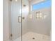 Walk-in shower with herringbone tile, glass enclosure, and built-in seat at 212 Meadow Walk Dr, Fuquay Varina, NC 27526
