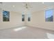 Spacious bedroom featuring large windows and ceiling fan at 212 Meadow Walk Dr, Fuquay Varina, NC 27526