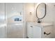 Vanity area with modern sink and mirror, plus view of bedroom at 212 Meadow Walk Dr, Fuquay Varina, NC 27526