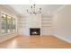 Living room features a fireplace and built-in shelving at 212 Meadow Walk Dr, Fuquay Varina, NC 27526