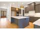 Modern kitchen with a large island and stainless steel appliances at 212 Meadow Walk Dr, Fuquay Varina, NC 27526