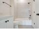 Bathroom with a bathtub, tile shower, and white vanity at 212 Meadow Walk Dr, Fuquay Varina, NC 27526