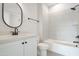Clean bathroom featuring a bathtub, tile surround, and modern vanity at 212 Meadow Walk Dr, Fuquay Varina, NC 27526