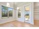 Bright breakfast room with hardwood floors and access to screened porch at 212 Meadow Walk Dr, Fuquay Varina, NC 27526