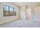 Spacious bedroom with large window and wall-to-wall carpet at 212 Meadow Walk Dr, Fuquay Varina, NC 27526