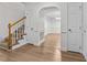 Bright entryway with hardwood floors and staircase at 1133 Stonewater Dr, Raleigh, NC 27603