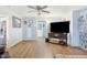 Spacious living area with hardwood floors and built in shelving at 102 W Church St, Benson, NC 27504