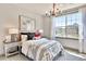 Bright bedroom with a bed, nightstands, and window at 902 Sw Maynard Rd, Cary, NC 27511