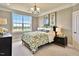 Bedroom with a bed, nightstands, and large window at 902 Sw Maynard Rd, Cary, NC 27511